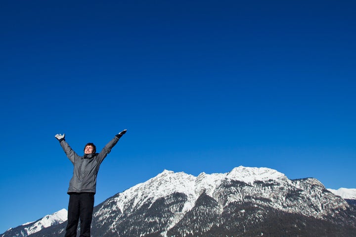 smiling skier on top of the...