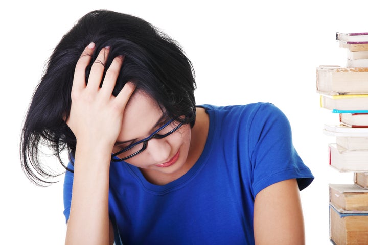 sad female student with...