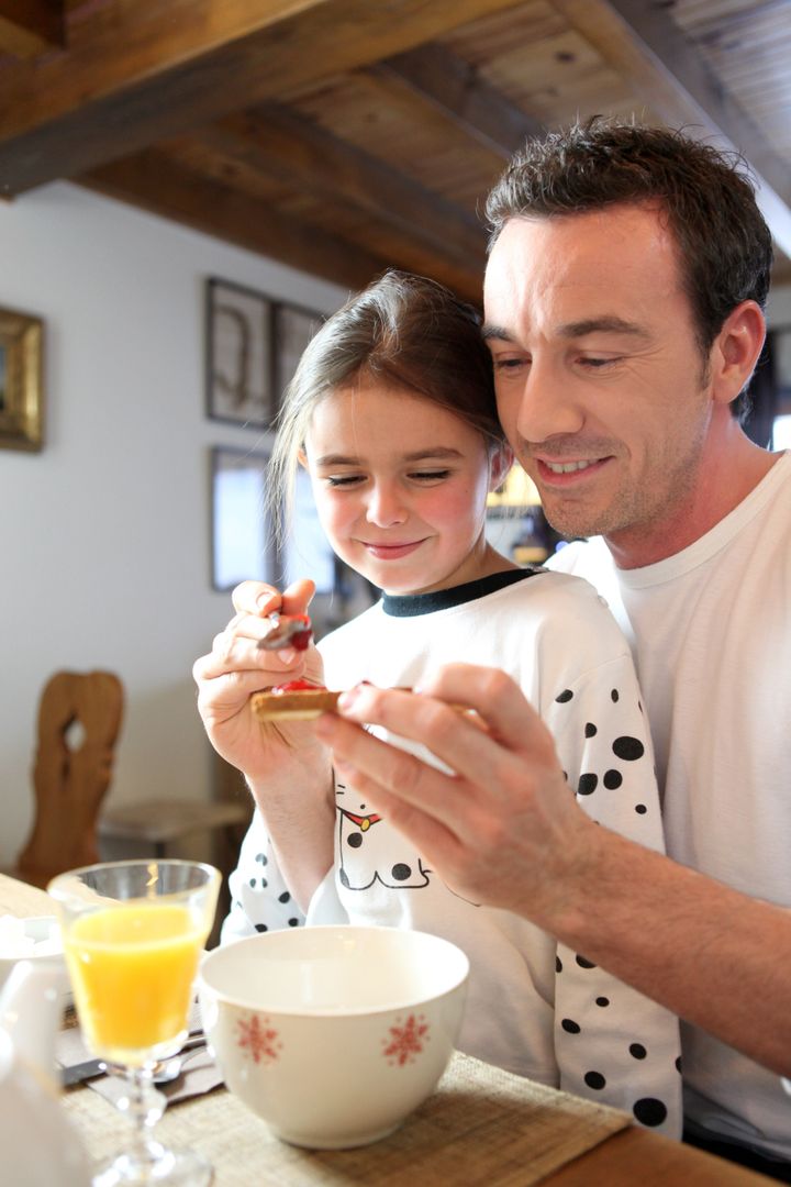 father and daughter at breakfast
