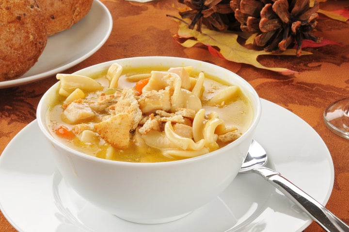 a bowl of turkey noodle soup on ...