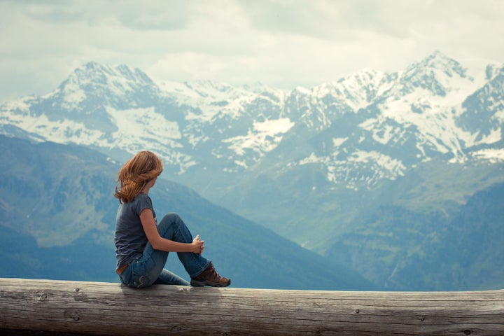 girl hiker sitting and...