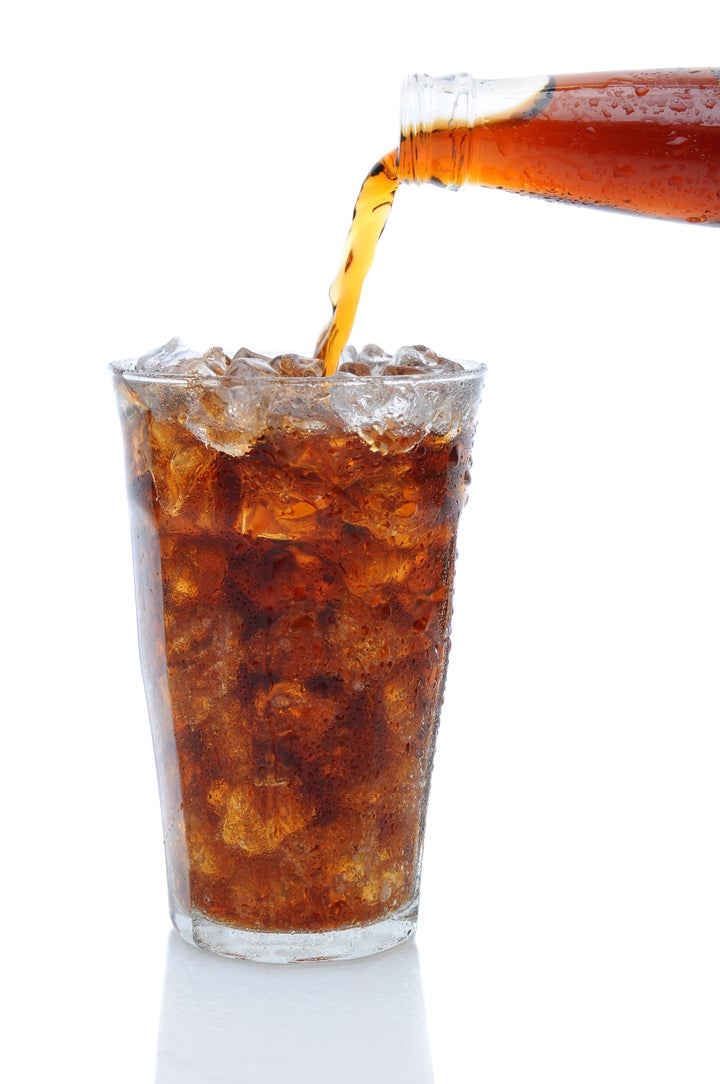 a bottle of cola soda pouring...