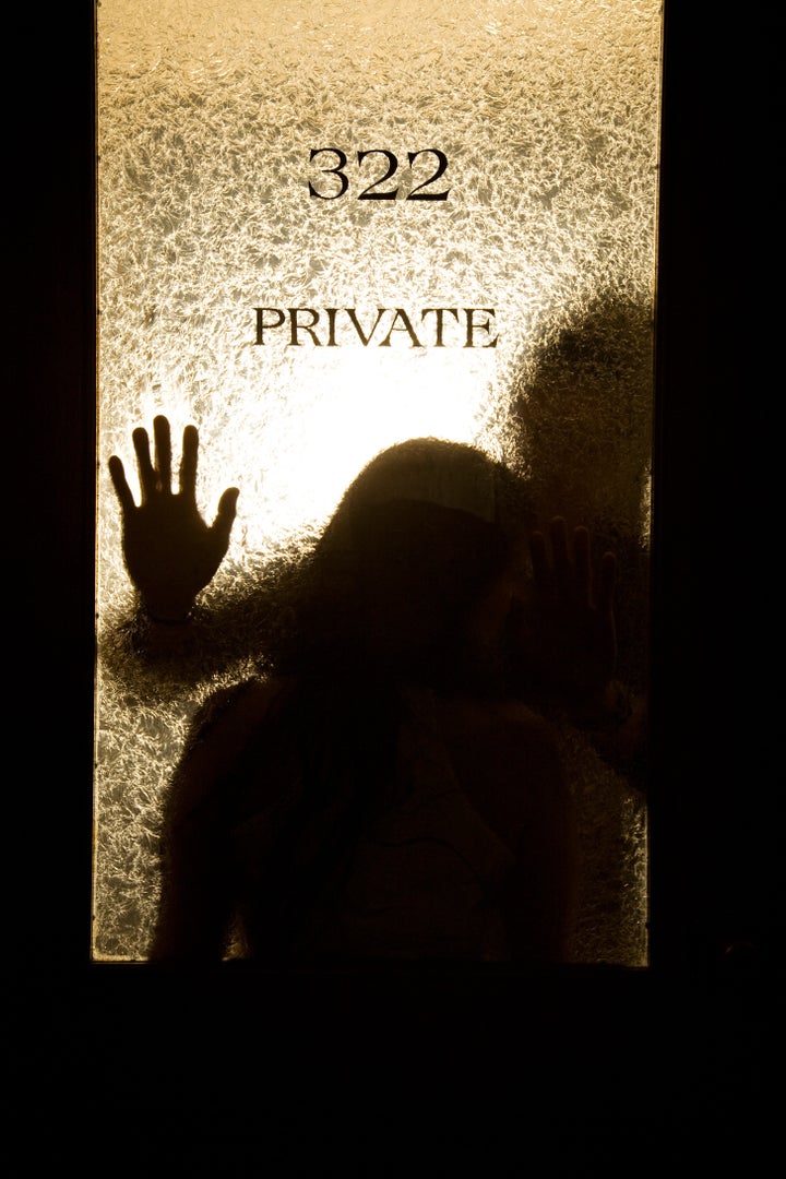 A silhouette shot of a business colleagues having an affair in the office