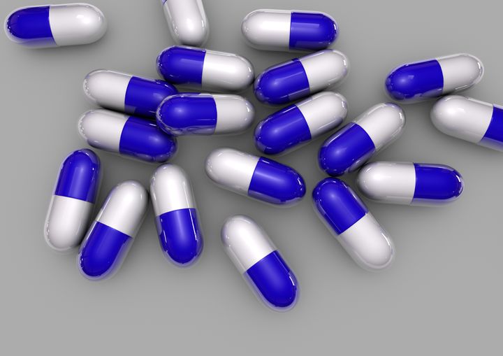 blue pills isolated on grey