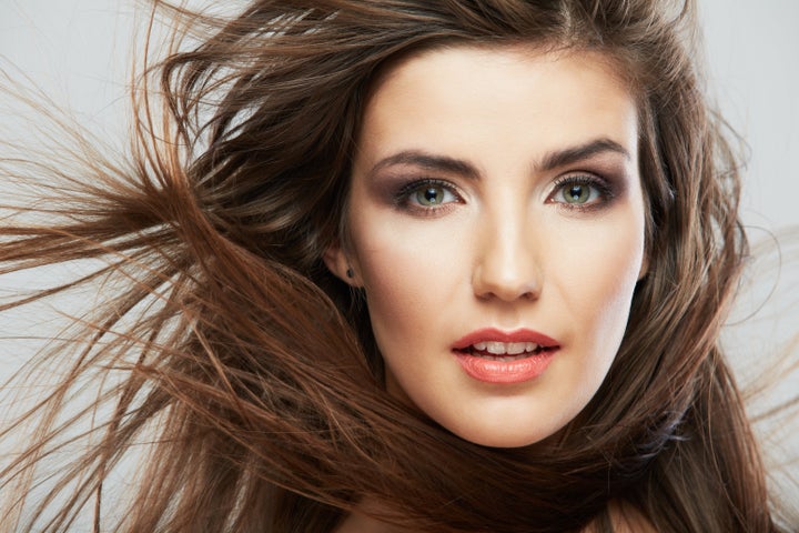woman face with hair motion on...