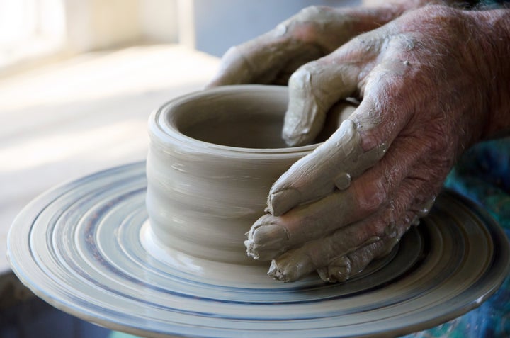 the creation of pottery on wheel