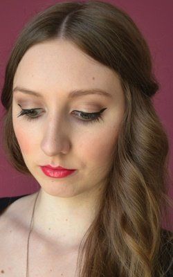 Winged-Out Eyeliner and Pink Lips