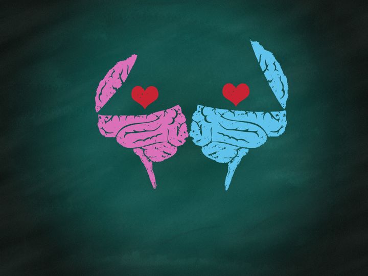 Brain connection to heart by hand drawing on green chalkboard,relations concept