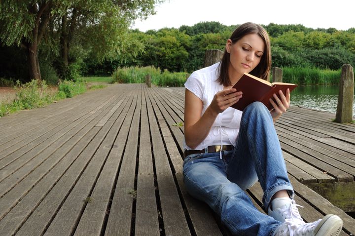 Woman reading book outdoor