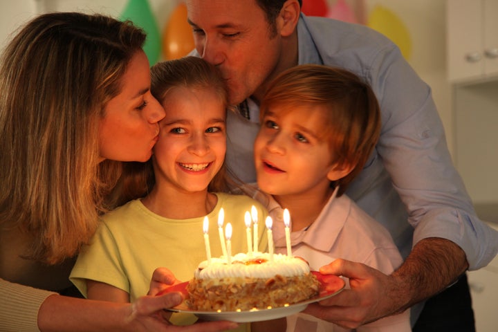 Family celebrating child's birthday