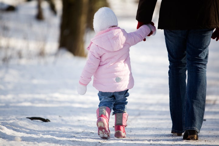 Little girl outdoors with her mother