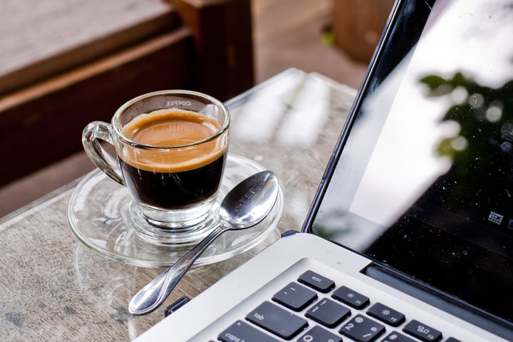 Coffee cup and laptop for business.