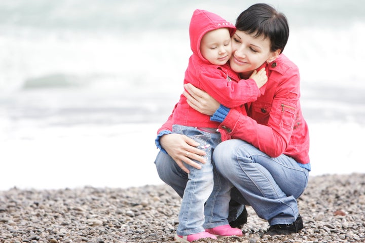 loving mother and daughter on beach