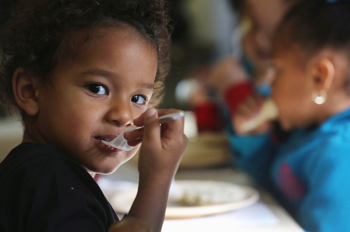 WOODBOURNE, NY - SEPTEMBER 20: Jiovani, 3, eats breakfast at the federally-funded Head Start Program school on September 20,