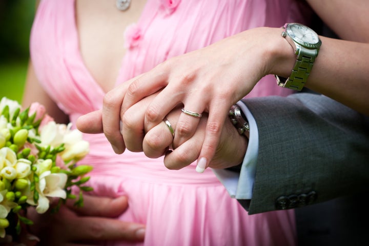 young married couple holding...