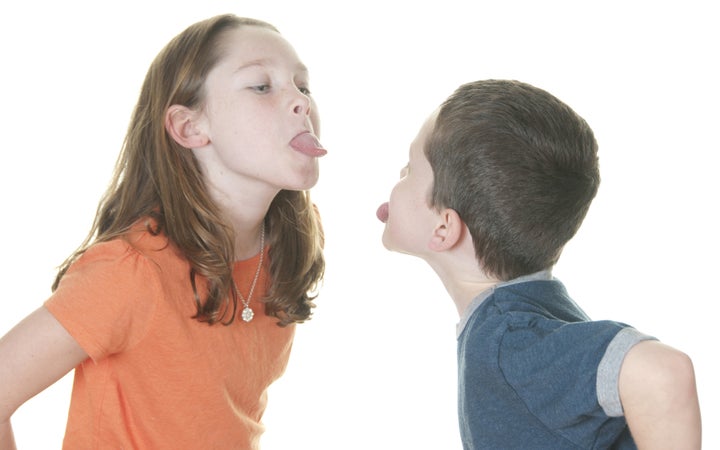 young girl and boy in fight