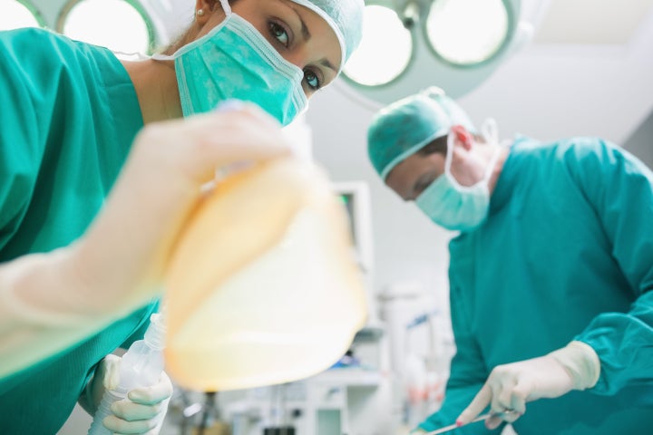 close up of a nurse holding an...