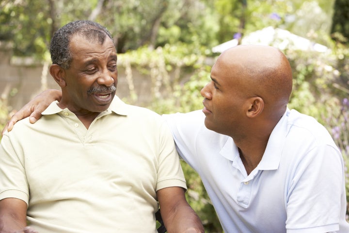 Senior Man Having Serious Conversation Adult Son