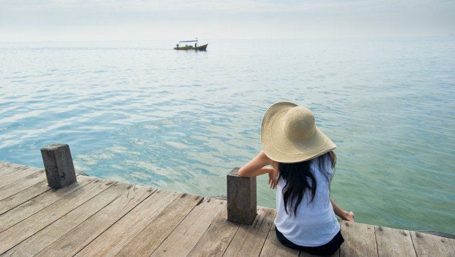 woman waiting for boat at the dock