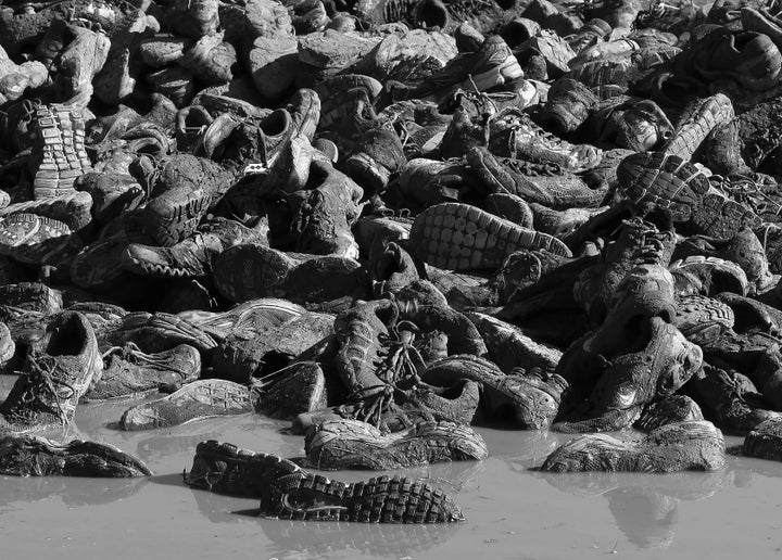 ENGLISHTOWN, NJ - OCTOBER 21: (EDITOR'S NOTE: This digital image has been converted to black and white) Disgarded sneakers from competitors litter the ground following the Tough Mudder event at Raceway Park on October 20, 2012 in Englishtown, New Jersey. (Photo by Bruce Bennett/Getty Images)