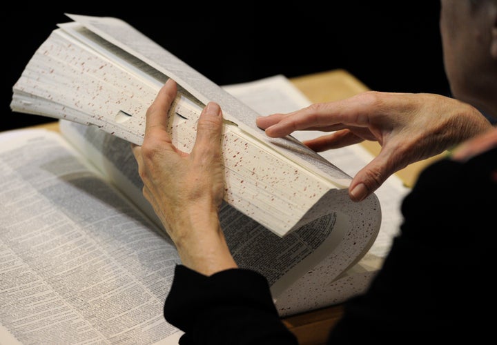 The judges use their dictionaries to confirm the spelling of the words. Spellers compete in The Denver Post 72nd Annual Colorado State Spelling Bee at the Colorado Convention Center in Denver on Saturday, Mar. 10, 2012. Kathryn Scott Osler, The Denver Post (Photo By Kathryn Scott Osler/The Denver Post via Getty Images)