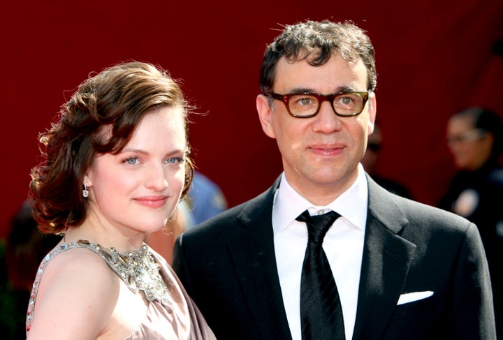 LOS ANGELES, CA - SEPTEMBER 20: Actors Elisabeth Moss (L) and Fred Armisen arrive at the 61st Primetime Emmy Awards held at