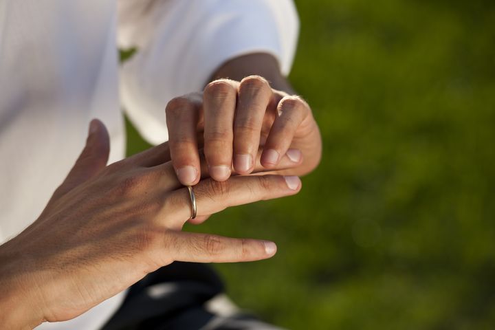 male hands with wedding ring