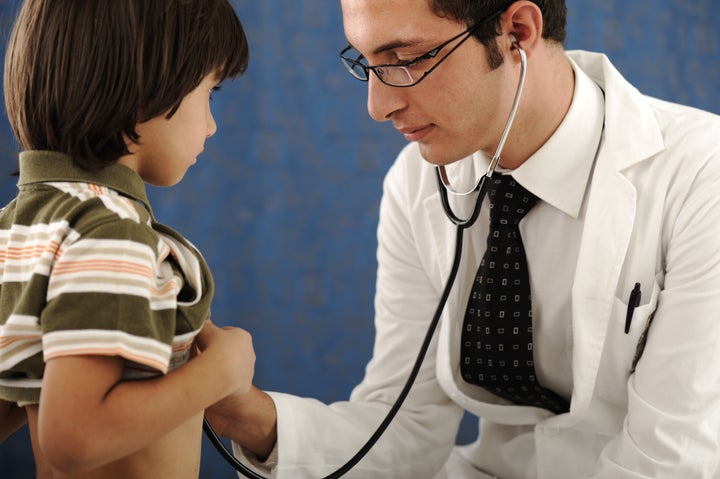 healthy kid boy , visiting a doctor