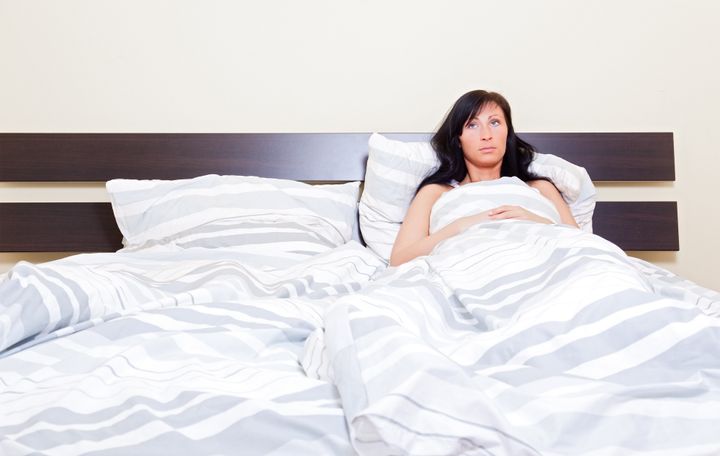 insomnia Woman waiting of husband lying alone sleepless while having relationship problems