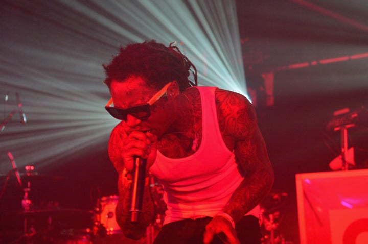 NEW ORLEANS, LA - FEBRUARY 02: Lil Wayne performs at the GQ Super Bowl party sponsored by Lacoste and Mercedes-Benzat The Elms Mansion on February 2, 2013 in New Orleans, Louisiana. (Photo by Gustavo Caballero/Getty Images for GQ)