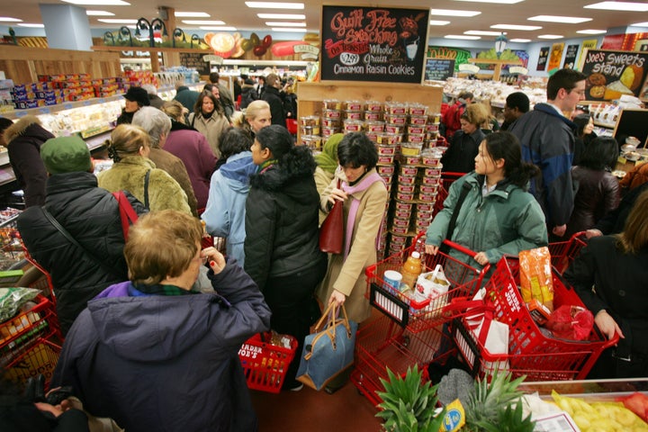 NEW YORK - MARCH 17: Shoppers line up inside Trader Joe's for the grand opening on 14th Street on March 17, 2006 in New York City. Trader Joe's, a specialty retail grocery store, has more than 200 stores in 19 states. (Photo by Michael Nagle/Getty Images)