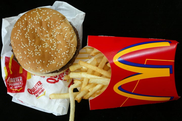 MIAMI, FL - JUNE 19: A McDonald's quarterpounder and a large order of french fries is seen June 19, 2003 in Miami, Florida. News reports say that In response to warnings that use of antibiotics on U.S. farms is making the drugs less effective for treating people, the fast-food chain is directing some meat suppliers to stop using antibiotic growth promoters altogether and encouraging others to cut back. (Photo by Joe Raedle/Getty Images)
