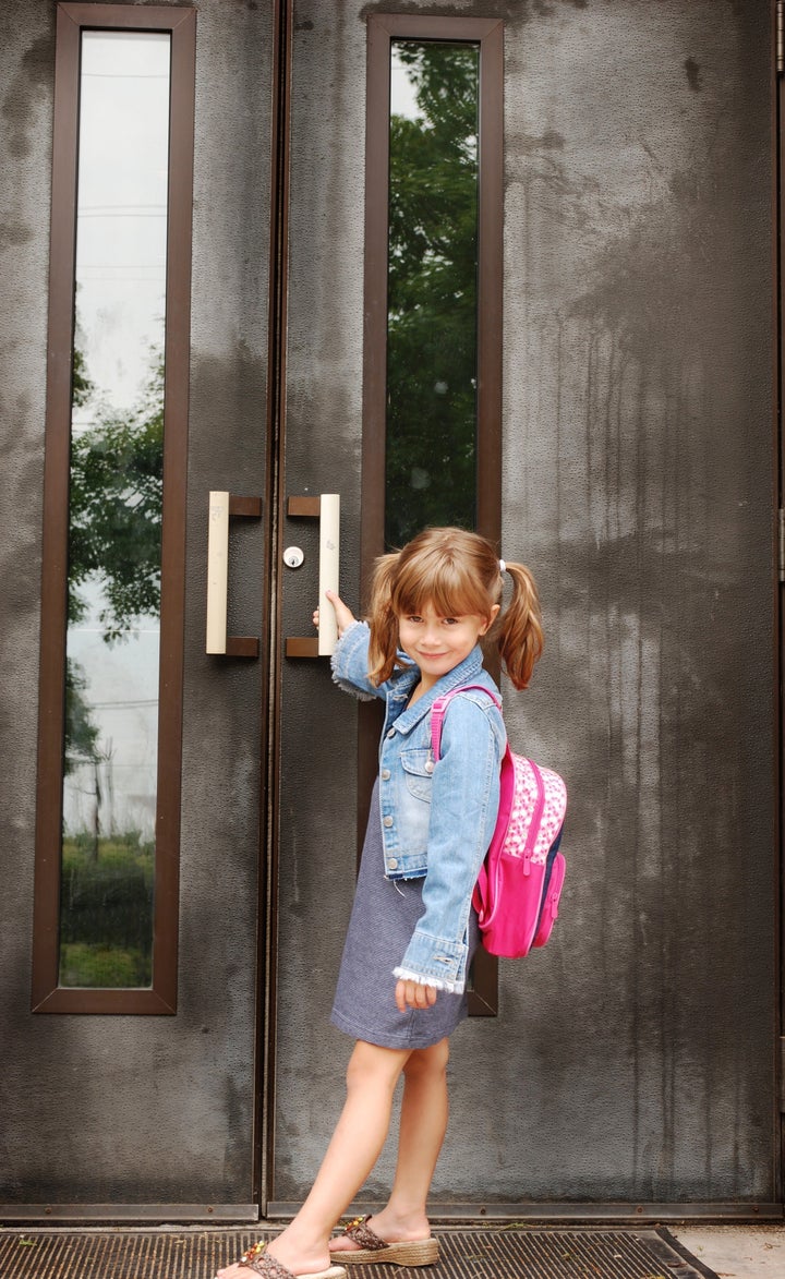 A cute young girl going to school