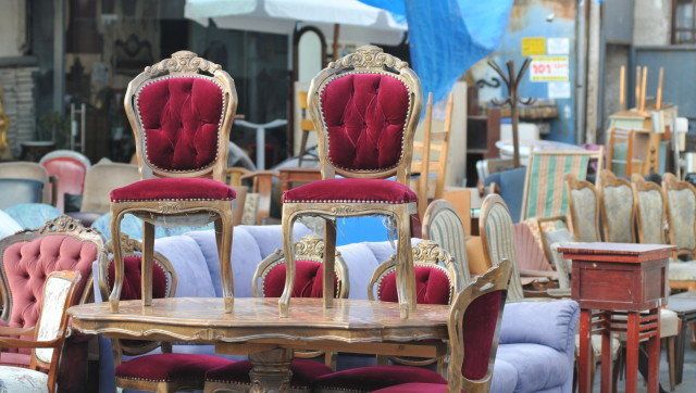 Antique Chairs on a table at flea market of Tel-Aviv
