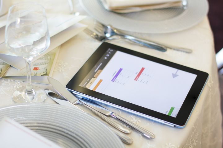 Tablet used for tables planning at a wedding.