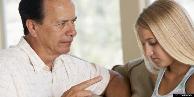 Man Having A Serious Talk With His Daughter