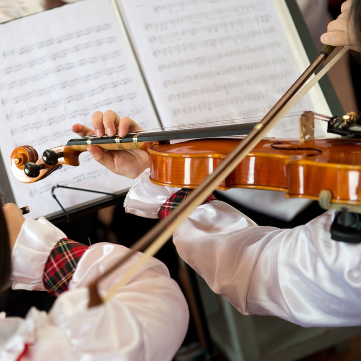 the pupils playing the violin...