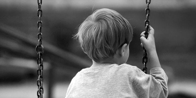 Lonely boy in the park, black and white photo