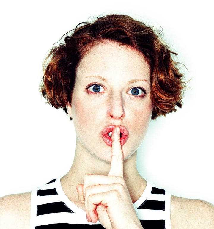 WOMAN WITH FINGER OVER LIPS, PORTRAIT, CLOSE-UP