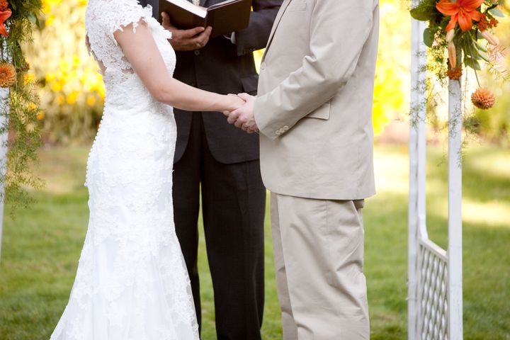 Couple Getting Married at an Outdoor Wedding Ceremony
