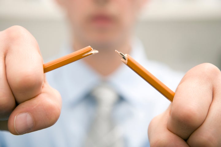 Business Man Breaking Pencil