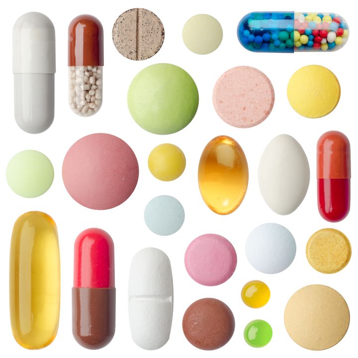many colorful pills isolated on ...