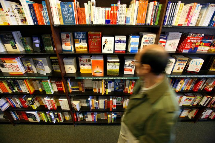 UNITED STATES - MARCH 16: A customer in a New York book store walks past a wall of diet books, March 16, 2006. The low-carbohydrate Atkins diet, which experienced a peak of popularity two years ago, isn't safe and shouldn't be recommended for weight loss, according to doctors writing in The Lancet. (Photo by Adam Rountree/Bloomberg via Getty Images)