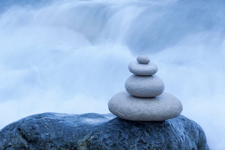 Stone pebbles balanced in a stack, Dorset, UK