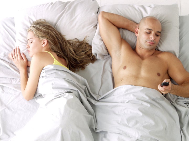 Latin american couple on bed.