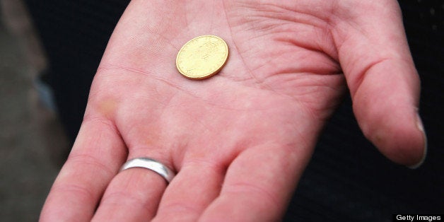 LONDON, ENGLAND - MARCH 31: An 1829 sovereign used in the coin toss is displayed prior to the BNY Mellon 159th Oxford versus Cambridge University Boat Race on The River Thames on March 31, 2013 in London, England. (Photo by Richard Heathcote/Getty Images)
