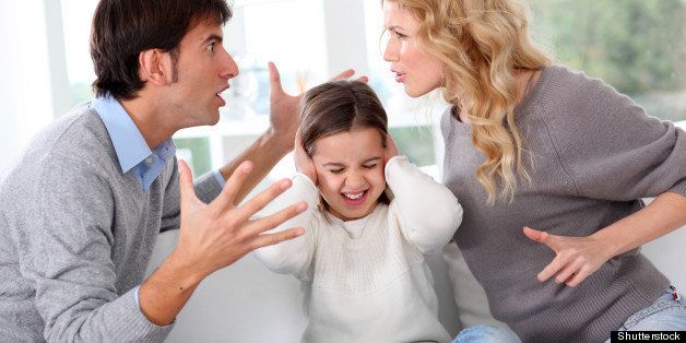 Couple fighting in front of child