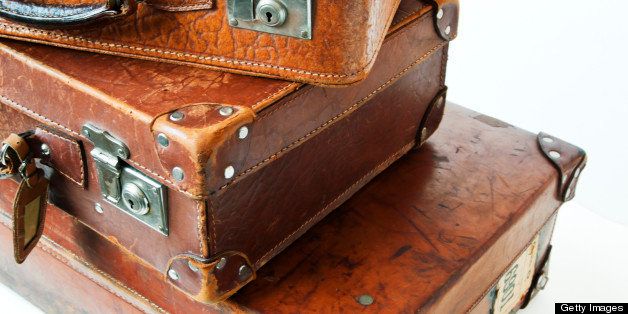 Vintage suitcases in a heap.