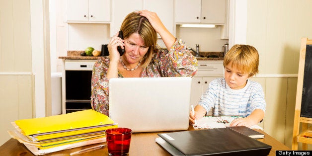 A photograph of a mother balancing career and home life.