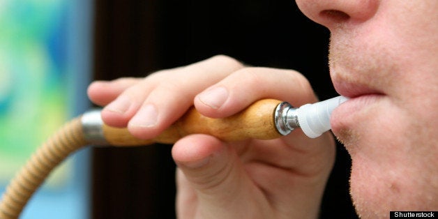 close up of a man smoking a...